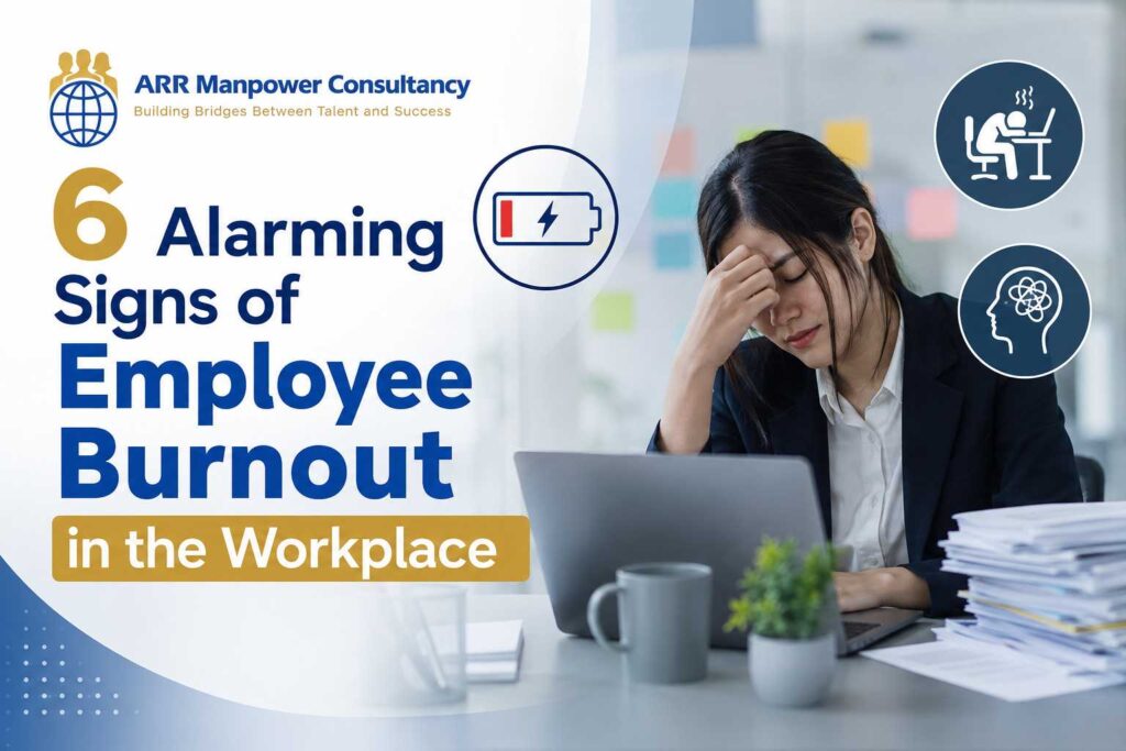A stressed office employee sits at a desk with a laptop and paperwork, showing signs of workplace burnout. The image features the ARR Manpower Consultancy logo and the headline “6 Alarming Signs of Employee Burnout in the Workplace,” along with icons representing exhaustion, mental fatigue, and low energy.